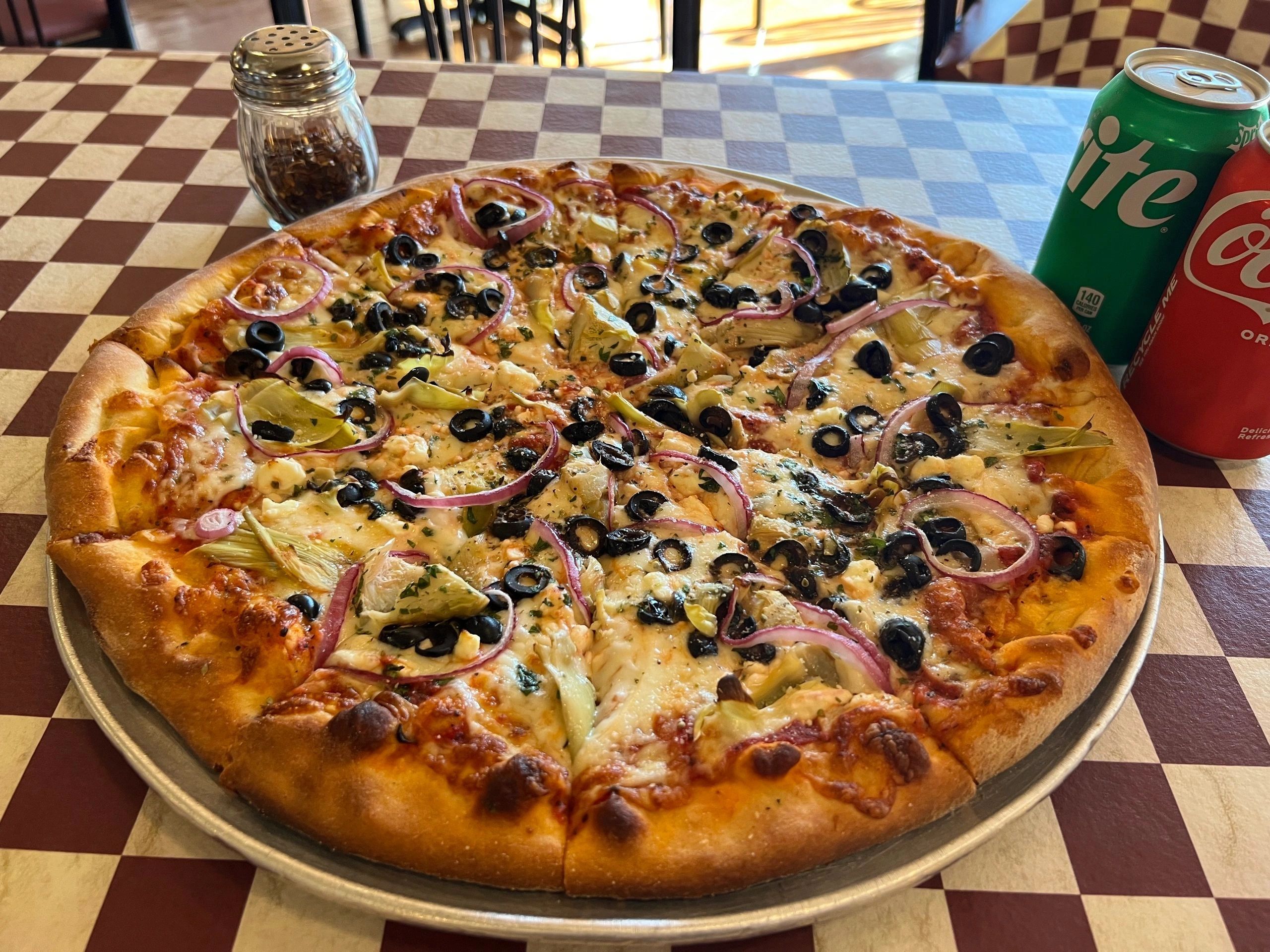 Pizza with olives and artichokes