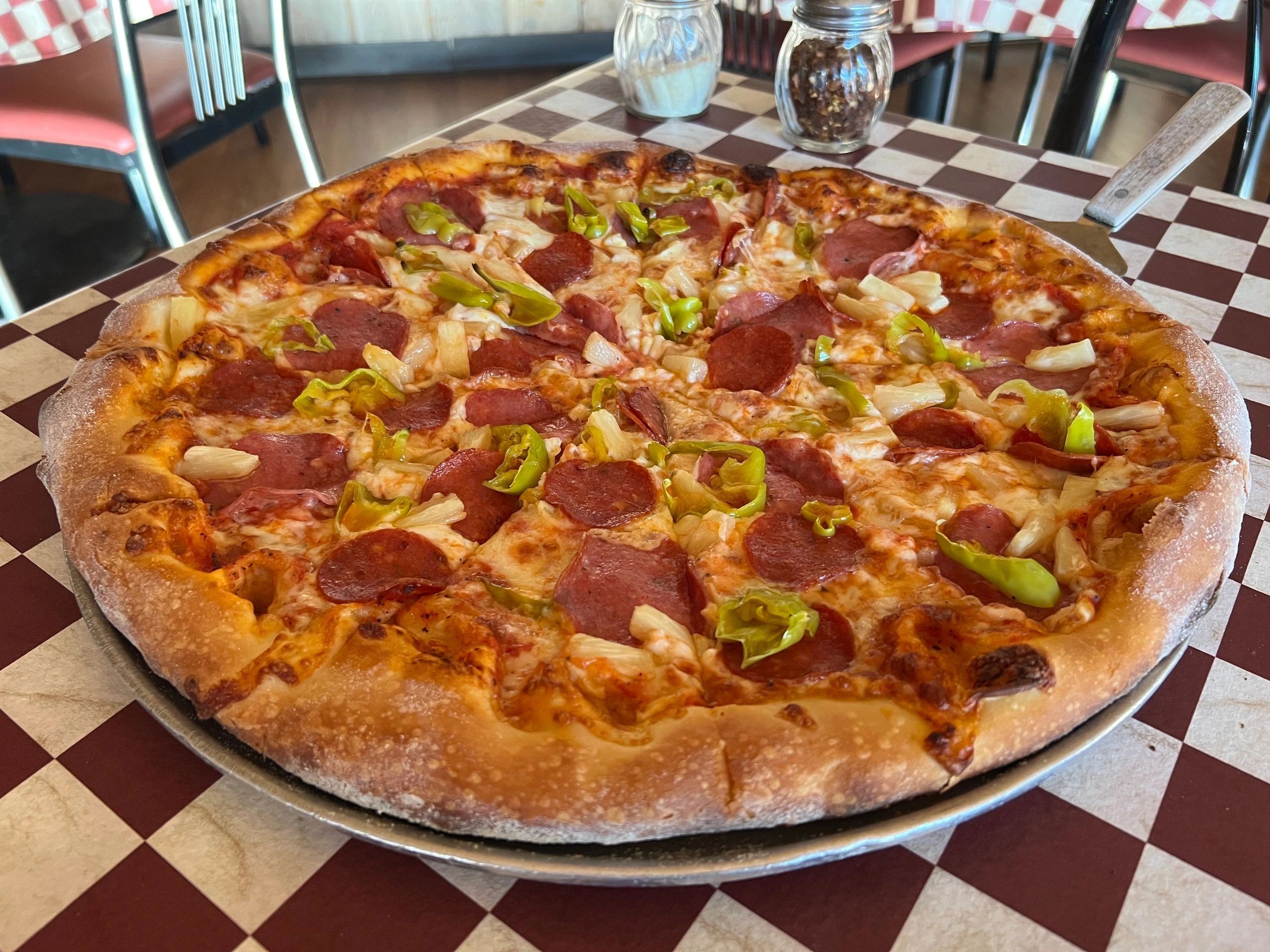 Pepperoni pizza at Village Pizza Restaurant