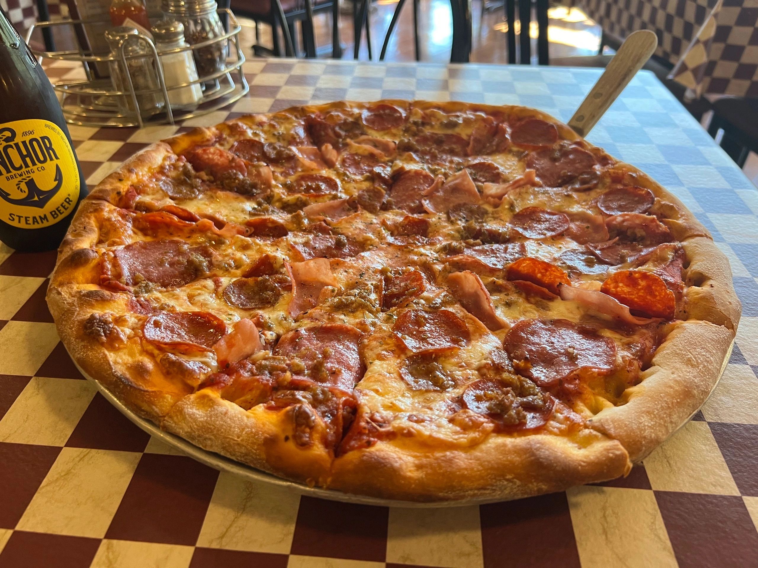 Meat pizza with Anchor Steam Beer